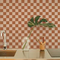 Check it out. Embrace a more-is-more mindset with this classic checkered print for your walls. Our checkered peel-and-stick wallpaper adds quirky comfort to your space, making a graphic statement anywhere. Checkmate is available in neutral and blush colorways.