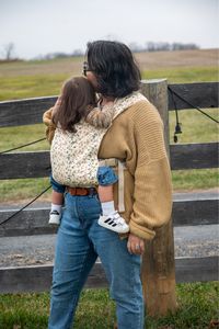 Our Lark Carrier: Loved by Caretakers, Adored by Babies! 💖👶 Our cozy and stylish carrier isn't just a hit with parents; it's a favorite among the little ones too! Experience the joy of babywearing where both caretakers and babies find comfort in every snuggle. Because when it comes to love, the Lark knows no bounds!