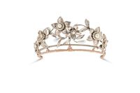 NO RESERVE - A FAUX PEARL AND WHITE PASTE TIARA in silver, designed as a floral spray set with fa