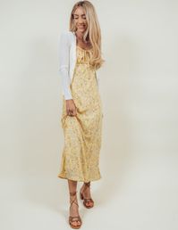 Effortlessly chic and feminine, the Leigh Floral Midi Dress is a must-have for any fashion-forward individual. Its adjustable spaghetti straps provide a perfect fit, while the slight gathered detail on the sides adds a flattering touch. The floral rushed bust with a front tie brings a touch of whimsy, and the dress is