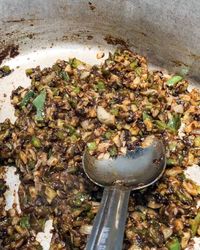 This meaty Louisiana Rice Dressing is a traditional Cajun rice dish that begins with a stock of roux and the Cajun trinity of onion, bell pepper, and celery. Then the roux and vegetables are simmered with ground beef, pork meat, and cooked fluffy white rice. It's delicious as a side or main dish.