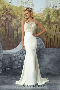 Modern crepe fit and flare wedding gown with square neckline beaded bodice.