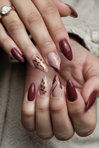 Embrace the beauty of autumn with these chic acrylic fall nail ideas that perfectly capture the season's essence. Picture deep burgundy and burnt orange swirls adorned with delicate gold leaf accents, showcasing a warm, inviting vibe. These nails not only add a touch of sophistication but also express your appreciation for fall窶冱 rich colors. Get inspired and bring the essence of autumn to your fingertips!