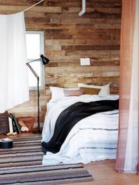 Imitation wood paneling can offer the warmth of the real thing…  http://blog.drummondhouseplans.com/2013/10/23/touch-of-wood-inside-the-house-decoration/