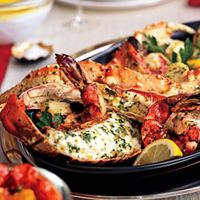 Indulgence on a platter: Lobster, shrimp, scallops, and crab legs make one impressive presentation. (Ask the market to cut the lobster tails and crab legs in half lengthwise for you.) A selection of sauces adds to the party fun.