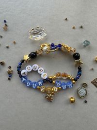 Handmade Era's Tour friendship bracelet -you're on your own kid midnights made to order - please note feature beads may vary in colour slightly dependent on bead availability.