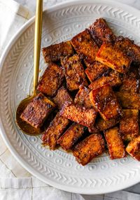 This Marinated Tofu recipe will make you fall in LOVE with tofu with LOTS of great tips! It's great for baking, pan-frying, grilling, in the air fryer and so much more! Perfect for a multi-purpose simple marinade and makes your tofu so flavourful.