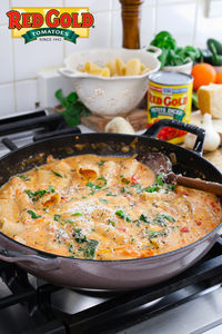 This Creamy Tomato Basil Pasta is the perfect weeknight dinner and comes together in just 30 minutes! You will cook the dry pasta directly in the pan making this a one pan meal with easy cleanup! Made with Red Gold® Petite Diced Tomatoes, cherry tomatoes, and more this dish is bursting with flavor. Be sure to pin and try on your next busy weeknight! @thefeedfeed #RedGoldTomatoes #RedGold #CreamyTomatoBasilPasta #PastaRecipes #OnePanMeals #30MinuteMeals