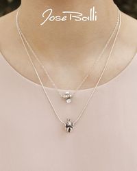 A sweet and petite smiling honey bee buzzes around on a dainty chain! Jose calls this design "Sarah's Honey Bee" since it was inspired by a drawing his daughter Sarah made when she was four years old. |$45.00| · Sterling silver · 16" length · Bee 1/2"L x 3/8"W · Lobster catch · Made in New Orleans · 1 year warranty · Complimentary gift packaging · Free shipping · Free catalog · Free postcard designed by Jose · Free biography card about Jose