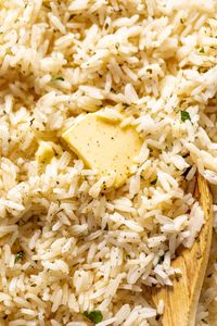 Garlic Butter Rice served with melted butter and cracked black pepper | craveitall.com