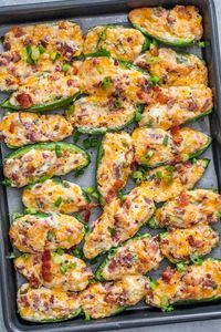 An easy recipe for the BEST oven baked jalapeno poppers! Jalapeños stuffed with a cheesy and creamy bacon filling, great for any occasion!