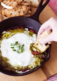 Burrata Crostini with Tomato Jam and Pesto. Easy Tomato Jam recipe and store bought pesto make this an easy and crowd pleasing appetizer.