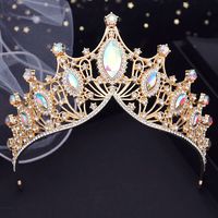 Step into the world of luxury with our Crystal High Point Tiaras Crown, the perfect party accessory for your hair. Vintage styling, a variety of crystal colors to choose from, and a sturdy metal construction make this tiara crown a must-have for any special occasion. Its high point and curved crystal lined bottom rim add an elegant touch to your look, while the loop ends allow you to effortlessly add a veil for a truly regal look. Elevate your style with this exquisite jewelry accessory. materia