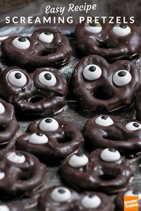 If you are looking for party or preschool Halloween snacks, this freakishly easy Halloween recipe will have your guests screaming for more. It features crunchy mini twist pretzels that have been dunked in melted dark chocolate (add a little vegetable oil to the chocolate for smoothness) and topped with candy eyeballs. Allow to set for 30 minutes. Open wide!