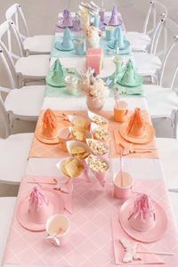 Similar to the previous table settings, this next easy rainbow party idea is just as beautiful, only this time in pastel shades of color, which create a softer toned-down ambiance. Recreating some rainbow for the table settings is a fun way to stay on theme and a lovely party decoration too. See more party ideas and share yours at CatchMyparty.com