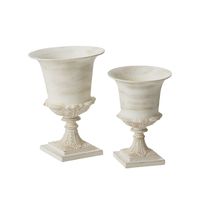 Beautifully striking yet down to earth with its slightly distressed warm white finish, the metal Chapel Urn offers a timeless, versatile spot for florals to shine. Featuring a square base, dimensional leaf details on the body & gold undertones, this urn is a classic piece for, wedding, event, holiday, or everyday displays. A large basin holds lots of water for stems, while a floral dish can fit on top or a container can stay hidden inside. DETAILS: 10"x 14.5" 12.25"x 17" Weight 7.000000 10.00000