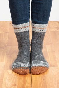 Broken rib patterns in both the cuff and body of these socks add a little twist to the traditional design, as well as adding a nice degree of elasticity for a stretchy fit.