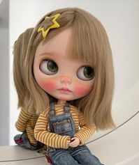 blythe doll with blonde hair