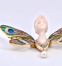 This piece is wonderful a plique a jour Butterfly with a carved Chalcedony Ladies Face.  This is in the likes of Lalique, Vever, Gaillard and Fouquet which were masters of Art Nouveau Jewelry.  These firms made items similar to this listing.  This piece is not marked at all but it is remarkable.  This piece weighs 11.72 grams is 2 .25 wide and 1" long.  There are small Diamonds through the wings and Diamonds on the bottom of the bust and a Pearl.  The head or face of this piece is exquisitely ca