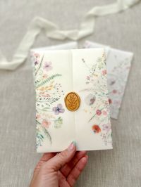 Vellum jacket for invitations featuring colorful watercolor wildflowers, perfect for any 5x7 invitation. They can hold an A7 (5x7) invitations as well as inserts if any. ❗️VIEW MORE WRAP'S DESIGNS https://etsy.me/3XK9f8N ❗️VIEW WAX SEALS https://etsy.me/3XgEau1 They come pre-scored for an easier and precise fold. Ship flat  Please note cards, extra inserts or wax seals are not included, just the vellum wraps. If you're interested in invitations or other details you can take a look a my full cata