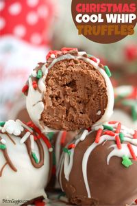 Christmas Cool Whip Truffles - Rich, whipped chocolate dipped in candy coating and topped with sprinkles, these festive truffles are an easy and delicious holiday treat!