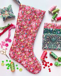 Ready for a stocking upgrade? Start your holiday prep by making some beautiful Jingle Stockings for the mantel! Make a simple stocking that showcases your Liberty fabrics or experience the wonderful process of Foundation Paper Piecing (FPP) candy stripes with our Striped Jingle Stocking. Check out our NEW stocking patterns on our DuckaDilly Downloads page.  Follow along as we guide you through the process of making a Jingle Stocking.  This cute Christmas stocking is beautiful on the inside and