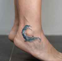 Wave tattooed on the ankle