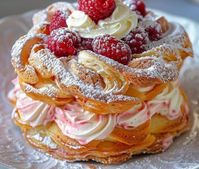 Ingredients:   1 cup water 1/2 cup unsalted butter 1/4 teaspoon salt 1 cup all-purpose flour 4 large eggs 1 cup heavy cream 2 tablespoons powdered sugar 1 teaspoon vanilla extract 1 cup fresh raspberries Additional powdered sugar for dusting Directions: Preheat the oven to 425°F (220°C). Line a baking sheet with parchment paper. In […]