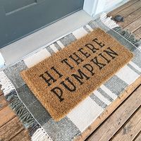 <p>Greet your guests with a little Southern charm and add an autumn vibe to your front door by using this <strong>Hi There Pumpkin Natural Coir Doormat</strong>. This doormat encourages your guests to brush off their shoes on this natural renewable material that is made from coconut shell fibers and is easy to maintain. A doormat that will welcome your guests and bring style to your fall decor at the same time.</p>