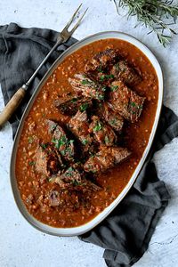 Italian Pot Roast (Stracotto) and Oven-Baked Gorgonzola Polenta is the ultimate Italian comfort food combination your family and friends will love!  Slowly braised beef in a red wine-infused sauce and an easy, hands-off polenta combine to create a dish for perfect stress-free entertaining! #italianfood #italianpotroast #potroast #straccato #meat #meatrecipes #polenta