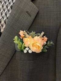 Pocket square boutonnières are a wonderful accessory for your groom, groomsmen, ushers, dads, grandpas and your officiant! They are also perfect for Prom and Homecoming!! They are a classy addition to the bridal party's suit jacket.  Instead of battling with corsage pins and having a crooked boutonnière, use a pocket square that you just slide into the pocket of the suit jacket where it will just sit nicely and behaved all day! The base of the boutonnière is 2.5 inches across and 4 inches tall plus the greenery and flowers making it about 7 inches tall total, with only 3 inches that will show. Please be sure to measure the opening of your jacket pocket. if you need a smaller size (ie for a ring bearer) kindly let me know the size that your pocket opening is so I can make it accordingly. Th