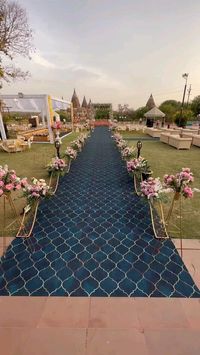 This stunning floral walkway and mandap with this breathtaking sundowner view ✨ ❤️