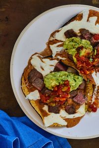 NYT Cooking: For centuries, Sonoran carne asada tacos have traditionally been assembled in flour tortillas. However, the corn tortilla, salted and crisped on the same grill that cooks and seasons the meat, has been added to the mix, creating a crunchy open taco called the Carne Asada Lorenza. Not only is it a sight to behold, but it has become such a favorite that it’s starting to rival the flour tortilla t...