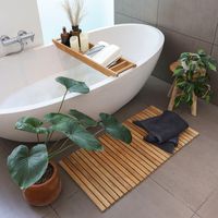 Treat your bathroom to an upscale look and cover plain or boring looking ground with this smooth and elegant string mat. Made from solid teak wood, our string mats offer the perfect combination of style and long lasting functionality.