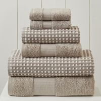 With the popularity of waffle fabrics and weaves, this towel set was inspired by the casual subtleties of easy living. A beautiful textured jacquard design with two tone appeal will enhance any bathroom. Soft tonal combinations in the jacquard towels are paired with a solid terry coordinate towel set for the perfect look. The solid towels have a simple dotted ticking stripe dobby that mimics the jacquard design in a smaller scale for great balance. Absorbent and wonderfully soft, your guests wil