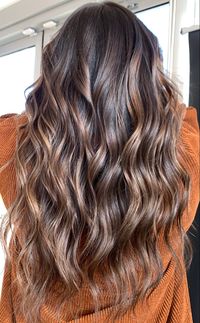 Reverse balayage with soft caramel tones and beacy waves