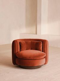 An extension of our Vivienne range, this swivel armchair takes its inspiration from the 1960s-inspired interiors of White City House. Upholstered in a cotton velvet fabric, pleated stitch detailing to the back of the chair makes it a versatile piece to sit in any area of the living room while adding a tactile point of interest. The oversized curved shape is an elevated take on the classic tub armchair, created for cozy, conversational moments in mind. Soho Home Vivienne Armchair, Velvet, Rust |