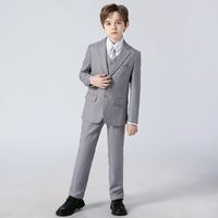 This Handsome Boys Tradition Suit Includes: A single breasted lined jacket - notched lapel, complete with three buttons and three pockets A fully lined vest with three front buttons Pleated full length pants with elastic waist for a comfortable and easy fit A long sleeve dress shirt with a lay down collar Pants sizes 2 - 14 have elastic bands as well as a zipper and button closure. This is a great suit for your little ring bearer. It is also ideal for their band or orchestra concert, communion,