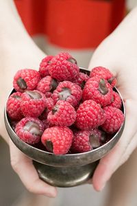 Chocolate filled raspberries in a bowl.