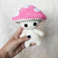 This free Crochet Mushroom Pattern will create a whimsical little friend. There is something irresistable about this amigurumi mushroom! Make a whole forest full with this free pattern!