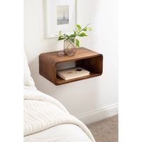 Introducing the Deguara floating side table - the perfect addition to your bedroom or living space! This modern floating nightstand is designed to add functionality and style to any room with its sleek and transitional design. The walnut finish adds warmth and elegance to your decor, making it a versatile piece that complements various interior styles. Featuring a simple, convenient design, this wood side table provides stylish storage space for your essentials, such as books, remotes, and other