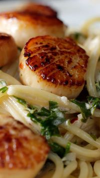 Rich and creamy garlic butter scallops on pasta... delightfully decadent!