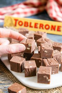 Learn how to make this easy, delicious, melt-in-the-mouth Toblerone fudge that needs only two ingredients! No boiling pans and no sugar thermometer needed. Make this easy chocolate fudge recipe in the microwave, slow cooker or a pan on the stove top. |best fudge recipe| how to make fudge| #choclate #dessert