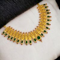 Ethnic Traditional Kerala Lakshmi Nagapadam Choker - a stunning piece of jewellery that combines the popular green Nagapadathali design with Lakshmi motifs that elevate its unexplored beauty. This premium gold plated necklace comes with an adjustable back chain, making it a versatile accessory that can be paired with any traditional attire, such as a dance costume, South Indian bridal wear etc.