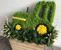 A tractor tribute for a farmer. His beloved John Deere. Made out of all fresh flowers, with a small amount of dried wheat.  By Signature Flowers Bucks & Oxon Ltd  #farmer #tractor #tractors #johndeere #floraltribute #funeralflowers