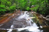 Sliding Rock swimming hole in NC..Sliding Rock, North Carolina This is a fantastic rock waterfall that is so smooth you can use it as a water slide. However, be warned, the water is very chilly. Though that’s probably a welcome respite from the scorching summer sun. Recently, these North Carolina summers have been crazy hot. Thanks a lot, global warming!