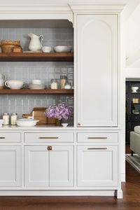 Tile by Ann Sacks; hardware by Top Knobs. Design by Centered by Design #benjaminmoore #kitchencabinets #brutonwhite