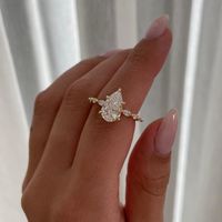 Celebrate your love with this stunning 3tcw Pear lab-grown diamond Engagement ring. Featuring a flawless Pear-shaped EF and VS diamond set in 10k/14k/18k White gold, it's both eco-friendly and elegant. 𝐈𝐆𝐈-𝐜𝐞𝐫𝐭𝐢𝐟𝐢𝐞𝐝 diamond for your peace of mind, this ring promises timeless beauty and an ethical choice. Perfect for a forever promise. 𝐂𝐞𝐧𝐭𝐞𝐫 𝐒𝐭𝐨𝐧𝐞 𝐃𝐞𝐭𝐚𝐢𝐥𝐬: ★ Shape: Pear ★ Size: 2.20ct ★ Color: EF ★ Clarity: VS ★ IGI-certified 𝐒𝐢𝐝𝐞 𝐒𝐭𝐨𝐧𝐞 𝐃𝐞𝐭𝐚𝐢𝐥𝐬: ★ Shape: Round And Marquise  ★ Size: Around 0.80ct Total ( Side Stone ) ★ Color: EF ★ Clarity: VS 𝐖𝐡𝐲 𝐂𝐡𝐨𝐨𝐬𝐞 𝐎𝐮𝐫 𝐋𝐚𝐛-𝐆𝐫𝐨𝐰𝐧 𝐃𝐢𝐚𝐦𝐨𝐧𝐝? - Superior Quality: Our lab-grown diamond offers exceptional brilliance and clarity. - Ethical and Sustainable: Enjoy conflict-free, environmenta