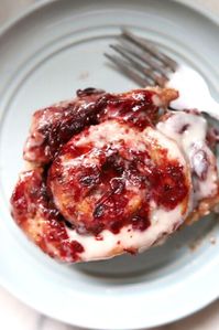 You'll want to save these for your Christmas and Thanksgiving dessert. These cranberry cinnamon rolls are stuffed with cranberry sauce with a regular cream cheese vanilla glaze and smeared with leftover cranberry sauce. #cranberryrolls #cranberrybuns