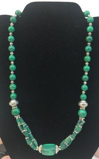 Beautiful stone necklace made out of Melakite stone. Size: 18"